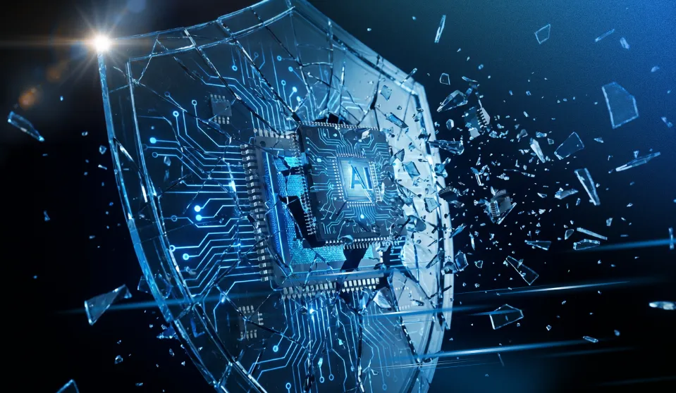 An image representing the theme of the blog: What Are the Security Risks of Moving Too Fast with AI? The image is blue and black, with a large shield with a chip in the middle labelled AI. There are shards of glass flying in the air.