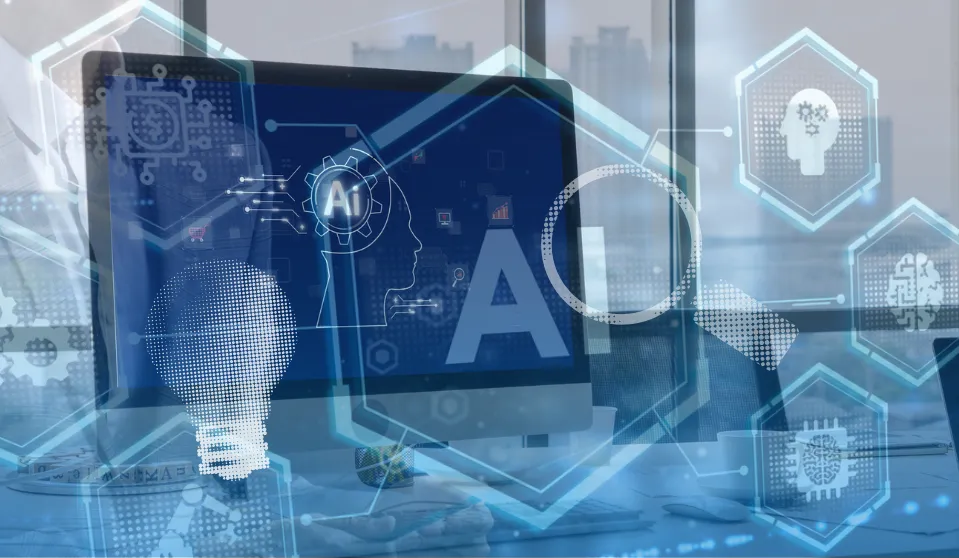 The image represents the title of the article "How Do You Build A Reliable AI Tool?" it is blue, with a computer on a desk, and icons super imposed, like some blue lightbulbs, AI icons, etc.